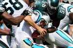 CHARLOTTE, NC - SEPTEMBER 13:  Quarterback Jake Delhomme #17 of the Carolina Panthers is sacked by Linebacker Jordan Akeem #56, of the Philadelphia Eagles in the first half of the NFL season opener at Bank of America Stadium on September 13, 2009 in Charlotte, North Carolina.  (Photo by Streeter Lecka/Getty Images)