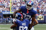 EAST RUTHERFORD, NJ - SEPTEMBER 13:  Mario Manningham #82 of the New York Giants celebrates his second quarter touchdown against the Washington Redskins with teammate Sinorice Moss #83 on September 13, 2009 at Giants Stadium in East Rutherford, New Jersey.  (Photo by Jim McIsaac/Getty Images)