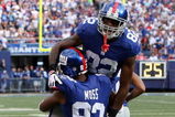 EAST RUTHERFORD, NJ - SEPTEMBER 13:  Mario Manningham #82 of the New York Giants celebrates his second quarter touchdown against the Washington Redskins with teammate Sinorice Moss #83 on September 13, 2009 at Giants Stadium in East Rutherford, New Jersey.  (Photo by Jim McIsaac/Getty Images)