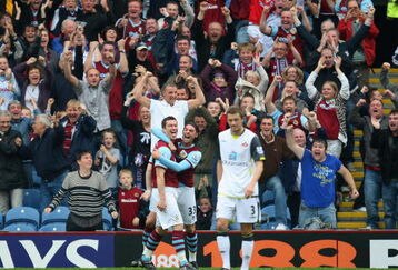 BURNLEY, ENGLAND - SEPTEMBER 19:   David Nugent of Burnley celebrates his second goal with team mate Chris Eagles during the Barclays Premier League match between Burnley and Sunderland at Turf Moor on September 19, 2009 in Burnley, England.  (Photo by Mark Thompson/Getty Images)