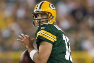 GREEN BAY, WI - SEPTEMBER 13: Aaron Rodgers #12 of the Green Bay Packers looks for a receiver against the Chicago Bears on September 13, 2009 at Lambeau Field in Green Bay, Wisconsin. The Packers defeated the Bears 21-15. (Photo by Jonathan Daniel/Getty Images)