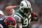 EAST RUTHERFORD, NJ - DECEMBER 14:  Shaun Ellis #92 of The New York Jets scores the go ahead touchdown on a fumble as Duke Preston #75 of The Buffalo Bills tries to make the tackle  during their game on December 14, 2008 at Giants Stadium in East Rutherford, New Jersey.  (Photo by Al Bello/Getty Images)