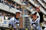 PITTSBURGH - JUNE 15:  Marc-Andre Fleury #29 and Sidney Crosby #87 of the Pittsburgh Penguins show off the Stanley Cup to the crowd on the Blvd of the Allies during the Stanley Cup Champion Victory Parade on June 15, 2009 in Pittsburgh, Pennsylvania.  (Photo by Jamie Sabau/Getty Images)