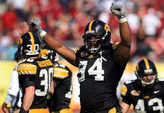 TAMPA, FL - JANUARY 01:  Adrian Clayborn #94 of the Iowa Hawkeyes celebrates after an interception against the South Carolina Gamecocks during the Outback Bowl on January 1, 2009 at Raymond James Stadium in Tampa, Florida.  (Photo by Scott Halleran/Getty Images)