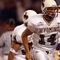 SEATTLE - SEPTEMBER 21:  Quarterback Casey Bramlet #14 of the Wyoming Cowboys runs on the field during the NCAA football game against the Washington Huskies on September 21, 2002 at Husky Stadium in Seattle, Washington.  The Huskies won 38-7.  (Photo by Otto Greule Jr/Getty Images)