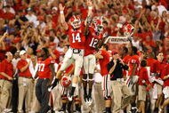 ATHENS, GA - SEPTEMBER 12:  Quarterback Joe Cox #14 and Tavarres King #12 celebrate a touchdown against the Georgia Bulldogs of the South Carolina Gamecocks at Sanford Stadium on September 12, 2009 in Athens, Georgia.  (Photo by Kevin C. Cox/Getty Images)