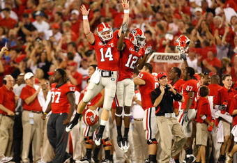 ATHENS, GA - SEPTEMBER 12:  Quarterback Joe Cox #14 and Tavarres King #12 celebrate a touchdown against the Georgia Bulldogs of the South Carolina Gamecocks at Sanford Stadium on September 12, 2009 in Athens, Georgia.  (Photo by Kevin C. Cox/Getty Images)