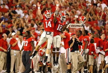 ATHENS, GA - SEPTEMBER 12:  Quarterback Joe Cox #14 and Tavarres King #12 celebrate a touchdown against the Georgia Bulldogs of the South Carolina Gamecocks at Sanford Stadium on September 12, 2009 in Athens, Georgia.  (Photo by Kevin C. Cox/Getty Images)