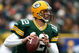 GREEN BAY, WI - NOVEMBER 30:  Aaron Rodgers #12 of the Green Bay Packers rolls out to pass against the Carolina Panthers at Lambeau Field on November 30, 2008 in Green Bay, Wisconsin. The Panthers won 35-31. (Photo by Jonathan Daniel/Getty Images)