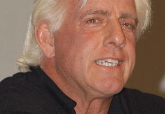 GARDEN CITY, NY - MARCH 3:  World Wrestling Entertainment (WWE) professional wrestler Ric Flair speaks on a panel during the 'Professor For A Day' event at Nassau Community College March 3, 2003 in Garden City, New York. Flair acted as an assistant professor to WWE CEO Linda McMahon, who lectured a group of sports marketing majors on the marketing and promotional strategies that have made the WWE a long-term success.  (Photo By Steven Henry/Getty Images)
