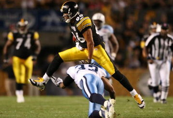 PITTSBURGH - SEPTEMBER 10:  Wide receiver Hines Ward #86 of the Pittsburgh Steelers leaps over safety Michael Griffin #33 of the Tennessee Titans in the second quarter of the NFL season opener at Heinz Field on September 10, 2009 in Pittsburgh, Pennsylvania. (Photo by Elsa/Getty Images)