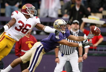 SEATTLE - SEPTEMBER 19:  Wide receiver Devin Aguilar #9 of the Washington Huskies just misses this catch at the goal line against Josh Pinkard #36 of the USC Trojans on September 19, 2009 at Husky Stadium in Seattle, Washington. The Huskies defeated the Trojans 16-13. (Photo by Otto Greule Jr/Getty Images)