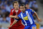 BARCELONA, SPAIN - AUGUST 02:  Ivan Vallejo (R) of Espanyol duels for the ball with  Lucas Leiva of Liverpool during the pre-season friendly match between Espanyol and Liverpool at the Nuevo Estadio de Cornella-El Prat on August 2, 2009 in Barcelona, Spain. Espanyol won the match 3-0.  (Photo by Jasper Juinen/Getty Images)