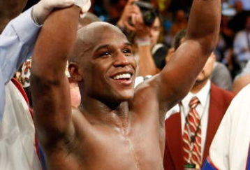 LAS VEGAS - SEPTEMBER 19:  Floyd Mayweather Jr. celebrates his unanimous-decision victory over Juan Manuel Marquez at the MGM Grand Garden Arena September 19, 2009 in Las Vegas, Nevada.  (Photo by Ethan Miller/Getty Images)