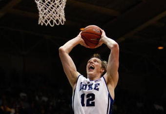 DURHAM, NC - DECEMBER 17:  Kyle Singler #12 of the Duke Blue Devils goes for the dunk during the game against the North Carolina Asheville Bulldogs on December 17, 2008 at Cameron Indoor Stadium in Durham, North Carolina. (Photo by Kevin C. Cox/Getty Images)