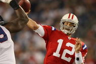 FOXBORO, MA - SEPTEMBER 14: Tom Brady #12 of the New England Patriots passes the ball as Marcus Stroud #99 of the Buffalo Bills defends on September 14, 2009 at Gillette Stadium in Foxboro, Massachusetts. The Patriots defeated the Bills 25-24. (Photo by Elsa/Getty Images)