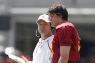LOS ANGELES, CA - APRIL 25: Quarterback Aaron Corp #15 of the USC Trojans listens to quarterback coach Jeremy Bates during the spring game on April 25, 2009 at the Los Angeles Memorial Coliseum in Los Angeles, California.  The cardinal team won 16-10.  (Photo by Jeff Golden/Getty Images)