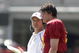 LOS ANGELES, CA - APRIL 25: Quarterback Aaron Corp #15 of the USC Trojans listens to quarterback coach Jeremy Bates during the spring game on April 25, 2009 at the Los Angeles Memorial Coliseum in Los Angeles, California.  The cardinal team won 16-10.  (Photo by Jeff Golden/Getty Images)