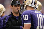SEATTLE - SEPTEMBER 19:  Head coach Steve Sarkisian of the Washington Huskies talks with quarterback Jake Locker #10 during the game against the USC Trojans on September 19, 2009 at Husky Stadium in Seattle, Washington. The Huskies defeated the Trojans 16-13. (Photo by Otto Greule Jr/Getty Images)