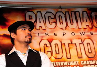 BEVERLY HILLS, CA - SEPTEMBER 14:  Manny Pacquiao listens as other speakers speack during the press conference at the Beverly Hills Hotel on September 14, 2009 in Beverly Hills, California.  (Photo by Jacob de Golish/Getty Images)