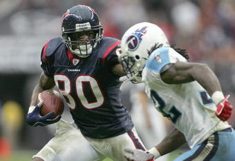 HOUSTON - DECEMBER 10: Andre Johnson #80of the Houston Texans carries the ball during the game against the Tennessee Titans on December 10, 2006 at Reliant Stadium in Houston, Texas. The Titans won 26-20 in overtime. (Photo by Stephen Dunn/Getty Images)