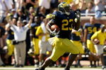 ANN ARBOR, MI - SEPTEMBER 19:  Running back Carlos Brown #23 of the Michigan Wolverines breaks away on  a 90 yard touchdown run against the Eastern Michigan Eagles at Michigan Stadium on September 19, 2009 in Ann Arbor, Michigan.  (Photo by Stephen Dunn/Getty Images)