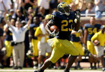 ANN ARBOR, MI - SEPTEMBER 19:  Running back Carlos Brown #23 of the Michigan Wolverines breaks away on  a 90 yard touchdown run against the Eastern Michigan Eagles at Michigan Stadium on September 19, 2009 in Ann Arbor, Michigan.  (Photo by Stephen Dunn/Getty Images)