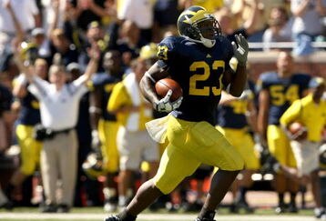 ANN ARBOR, MI - SEPTEMBER 19:  Running back Carlos Brown #23 of the Michigan Wolverines breaks away on  a 90 yard touchdown run against the Eastern Michigan Eagles at Michigan Stadium on September 19, 2009 in Ann Arbor, Michigan.  (Photo by Stephen Dunn/Getty Images)