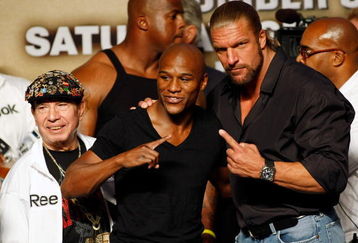LAS VEGAS - SEPTEMBER 18:  (L-R) Cornerman Rafael Garcia, boxer Floyd Mayweather Jr. and WWE wrestler Triple H pose during the official weigh-in for Mayweather's fight against Juan Manuel Marquez at the MGM Grand Garden Arena September 18, 2009 in Las Vegas, Nevada. The two will fight at the MGM on September 19.  (Photo by Ethan Miller/Getty Images)