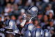 4 Aug 2001: A player of the Oakland Raiders holds up his helmet during the Pre-Season game against the Dallas Cowboys at the network Associates Coliseum in Oakland, California. The Raiders defeated the Cowboys 21-14.Mandatory Credit: Jed Jacobsohn /Allsport