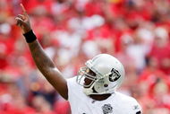 KANSAS CITY, MO - SEPTEMBER 20:  Quarterback JaMarcus Russell #2 of the Oakland Raiders celebrates after handing off for a touchdown in the final minutes of the 4th quarter during the Raiders' 13-10 victory over the Kansas City Chiefs during the game at Arrowhead Stadium on September 20, 2009 in Kansas City, Missouri.  (Photo by Jamie Squire/Getty Images)