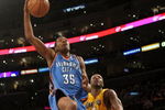 LOS ANGELES - FEBRUARY 10:  Kevin Durant #35 of the Oklahoma City Thundergoes up for a shot over Lamar Odom #7 of the Los Angeles Lakers on February 10, 2009 at Staples Center in Los Angeles, California.  The Lakers won 105-98.   NOTE TO USER: User expressly acknowledges and agrees that, by downloading and/or using this Photograph, user is consenting to the terms and conditions of the Getty Images License Agreement. (Photo by Stephen Dunn/Getty Images)