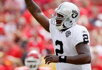 KANSAS CITY, MO - SEPTEMBER 20:  Quarterback JaMarcus Russell #2 of the Oakland Raiders celebrates after handing off for a touchdown in the final minutes of the 4th quarter during the Raiders' 13-10 victory over the Kansas City Chiefs during the game at Arrowhead Stadium on September 20, 2009 in Kansas City, Missouri.  (Photo by Jamie Squire/Getty Images)