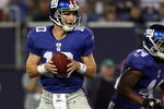 EAST RUTHERFORD, NJ - AUGUST 29:  Eli Manning #10 of the New York Giants looks to throw a pass against the New York Jets on August 29, 2009 at Giants Stadium in East Rutherford, New Jersey.  (Photo by Jim McIsaac/Getty Images)