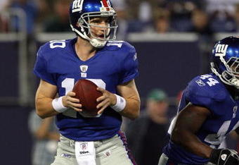 EAST RUTHERFORD, NJ - AUGUST 29:  Eli Manning #10 of the New York Giants looks to throw a pass against the New York Jets on August 29, 2009 at Giants Stadium in East Rutherford, New Jersey.  (Photo by Jim McIsaac/Getty Images)