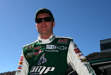 LOUDON, NH - SEPTEMBER 20:  Dale Earnhardt Jr., driver of the #88 AMP Energy/National Guard Chevrolet, stands on pit lane before the NASCAR Sprint Cup Series Sylvania 300 at the New Hampshire Motor Speedway on September 20, 2009 in Loudon, New Hampshire.  (Photo by Chris Trotman/Getty Images)
