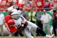 KANSAS CITY, MO - SEPTEMBER 20:  Quarterback JaMarcus Russell #2 of the Oakland Raiders is sacked by linebacker Derrick Johnson #56 of the Kansas City Chiefs during the game at Arrowhead Stadium on September 20, 2009 in Kansas City, Missouri.  (Photo by Jamie Squire/Getty Images)