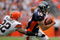 DENVER - SEPTEMBER 20:  Wide reciever Jabar Gaffney #10 of the Denver Broncos makes a reception and as Brandon McDonald #22 of the Cleveland Browns defends during NFL action at Invesco Field at Mile High on September 20, 2009 in Denver, Colorado. The Broncos defeated the Browns 27-6.  (Photo by Doug Pensinger/Getty Images)
