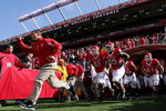 PISCATAWAY, NJ - OCTOBER 18:  Head coach Greg Schiano of the Rutgers Scarlet Knights leads his team onto the field to play the Connecticut Huskies at Rutgers Stadium on October 18, 2008 in Piscataway, New Jersey.  (Photo by Jim McIsaac/Getty Images)