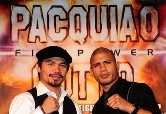 BEVERLY HILLS, CA - SEPTEMBER 14:  Manny Pacquiao and  Miguel Cotto pose for pictures during the press conference at the Beverly Hills Hotel on September 14, 2009 in Beverly Hills, California.  (Photo by Jacob De Golish/Jacob De Golish)