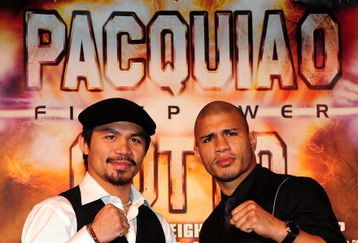 BEVERLY HILLS, CA - SEPTEMBER 14:  Manny Pacquiao and  Miguel Cotto pose for pictures during the press conference at the Beverly Hills Hotel on September 14, 2009 in Beverly Hills, California.  (Photo by Jacob De Golish/Jacob De Golish)