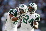EAST RUTHERFORD, NJ - SEPTEMBER 20: Dwight Lowery #21 of the New York Jets celebrates with teammate Darrelle Revis #24 after a turnover against the New England Patriots at Giants Stadium on September 20, 2009 in East Rutherford, New Jersey.  (Photo by Nick Laham/Getty Images)