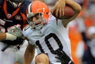 DENVER - SEPTEMBER 20: Quarterback Brady Quinn #10 of the Cleveland Browns is sacked by defensive end Elvis Dumervil #92 of the Denver Broncos in the fourth quarter during NFL action at Invesco Field at Mile High on September 20, 2009 in Denver, Colorado. The Broncos defeated the Browns 27-6. (Photo by Doug Pensinger/Getty Images)