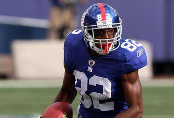 EAST RUTHERFORD, NJ - SEPTEMBER 13:  Mario Manningham #82 of the New York Giants runs in a second quarter touchdown against the Washington Redskins on September 13, 2009 at Giants Stadium in East Rutherford, New Jersey.  (Photo by Jim McIsaac/Getty Images)