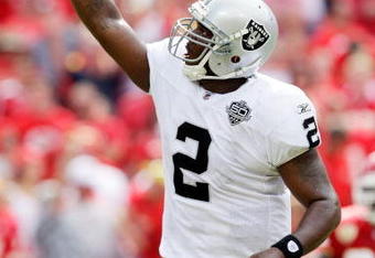 KANSAS CITY, MO - SEPTEMBER 20:  Quarterback JaMarcus Russell #2 of the Oakland Raiders celebrates after handing off for a touchdown in the final minutes of the 4th quarter during the Raiders' 13-10 victory over the Kansas City Chiefs during the game at Arrowhead Stadium on September 20, 2009 in Kansas City, Missouri.  (Photo by Jamie Squire/Getty Images)