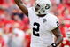 KANSAS CITY, MO - SEPTEMBER 20:  Quarterback JaMarcus Russell #2 of the Oakland Raiders celebrates after handing off for a touchdown in the final minutes of the 4th quarter during the Raiders' 13-10 victory over the Kansas City Chiefs during the game at Arrowhead Stadium on September 20, 2009 in Kansas City, Missouri.  (Photo by Jamie Squire/Getty Images)
