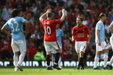 MANCHESTER, ENGLAND - SEPTEMBER 20:  Michael Owen of Manchester United celebrates scoring the winning goal in injury time with team mate Wayne Rooney during the Barclays Premier League match between Manchester United and Manchester City at Old Trafford on September 20, 2009 in Manchester, England.  (Photo by Alex Livesey/Getty Images)