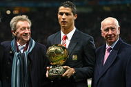 MANCHESTER, UNITED KINGDOM - DECEMBER 10:  Cristiano Ronaldo (C) of Manchester United receives the Ballon d'or as the European Footballer of the Year flanked by previous winners Denis Law (L) and Bobby Charlton before the UEFA Champions League Group E match between Manchester United and Aalborg at Old Trafford on December 10, 2008 in Manchester, England.  (Photo by Alex Livesey/Getty Images)