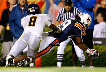 AUBURN, AL - SEPTEMBER 19:  Darvin Adams #89 of the Auburn Tigers scores a touchdown against Keith Tandy #8 of the West Virginia Mountaineers at Jordan-Hare Stadium on September 19, 2009 in Auburn, Alabama.  (Photo by Kevin C. Cox/Getty Images)