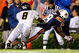 AUBURN, AL - SEPTEMBER 19:  Darvin Adams #89 of the Auburn Tigers scores a touchdown against Keith Tandy #8 of the West Virginia Mountaineers at Jordan-Hare Stadium on September 19, 2009 in Auburn, Alabama.  (Photo by Kevin C. Cox/Getty Images)